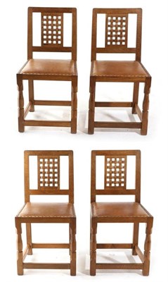 Lot 625 - Sid Pollard of Bagby: Four English Oak Lattice Back Dining Chairs, tan hide seats, on octagonal...