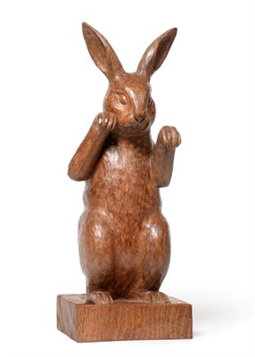 Lot 628 - Woodpeckerman: A Stan Dodds (1928-2012) Carved English Oak Boxing Hare, in an upright stance on...