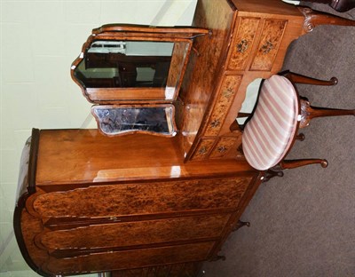 Lot 1263 - A burr walnut bedroom suite comprising dressing table, triptych mirror, stool, wardrobe and tallboy