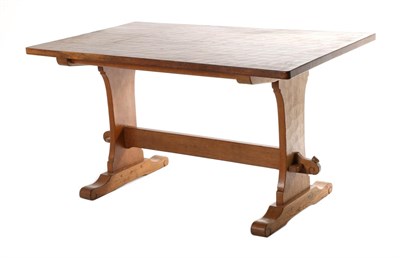 Lot 632 - Wrenman: A Bob Hunter English Oak 4' 6 " Refectory Table, on two shaped supports, joined by a...