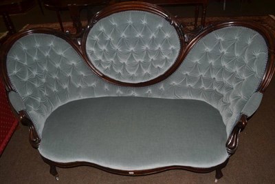 Lot 1310 - A Victorian walnut framed buttoned medallion back settee upholstered in pale blue velour