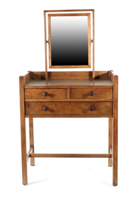 Lot 638 - A Heal & Son Ltd Oak Nursery Dressing Table, circa 1910, with pivoting mirror above two short...