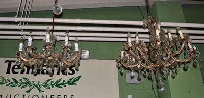 Lot 1331 - A Georgian style twelve light chandelier together with a similar ten light example (2)