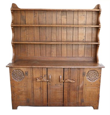 Lot 640 - A Jack Grimble of Cromer Oak Dresser, the plate rack above two cupboard doors, with exposed...