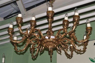 Lot 1332 - A patinated metal ten branch chandelier