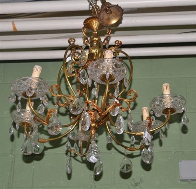 Lot 1334 - A gilt brass and cut glass six branch chandelier