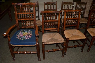 Lot 1348 - Four rush seat chairs, one with arms