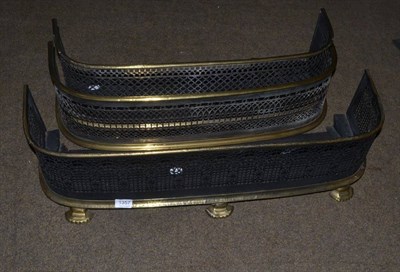 Lot 1357 - Three pierced brass fenders