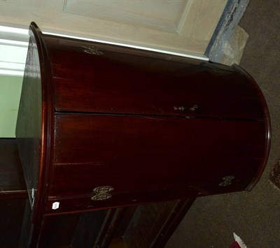 Lot 1371 - A Georgian mahogany hanging bow fronted corner cupboard