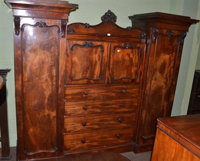 Lot 1373 - A Victorian mahogany inverted breakfront triple wardrobe