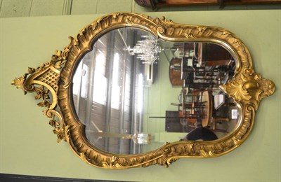 Lot 1381 - A small gilt framed mirror in the Rococo taste