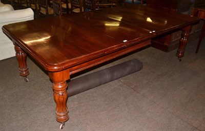 Lot 1384 - An early Victorian mahogany dining table, turned legs to castors