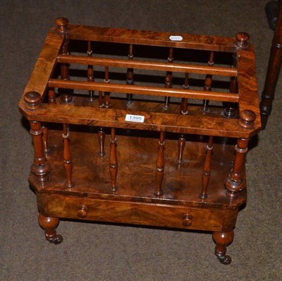 Lot 1395 - A walnut three division canterbury fitted with a base drawer