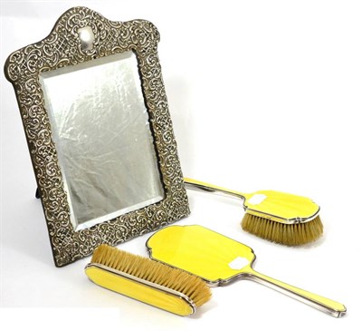 Lot 10 - Easel framed mirror with embossed silver mount and a three piece yellow enamel and silver...