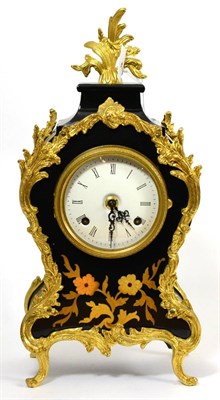 Lot 23 - Decorative modern brass mounted mantle clock and key, with enamel dial