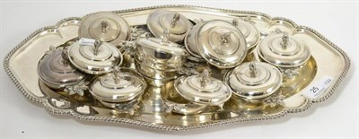 Lot 25 - A set of twelve Christofle EPNS small covered bowls and a shaped oval serving dish