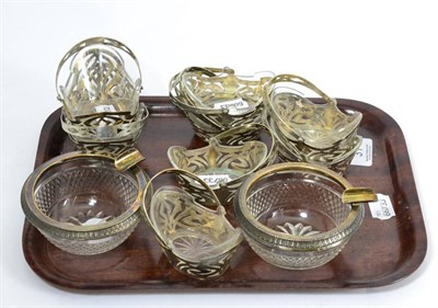 Lot 31 - A set of six small and two larger German Art Nouveau baskets in 800 silver with glass liners, and a