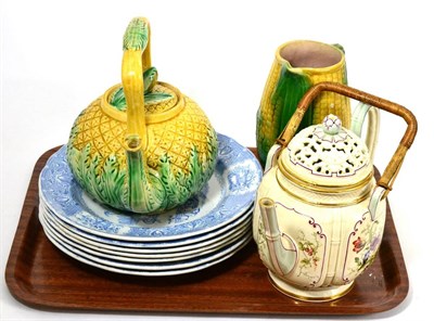 Lot 34 - An unusual teapot with reticulated lid, majolica and blue and white plates, pottery sweetcorn...