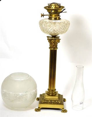 Lot 50 - A brass Corinthian column oil lamp with cut glass font