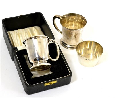 Lot 53 - Two silver christening cups and a small silver bowl (3)