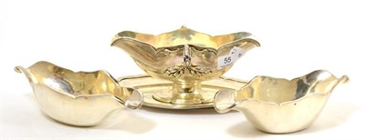 Lot 55 - French 950 silver sauce boat on fixed stand, with two silver liners