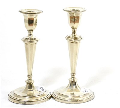 Lot 56 - A pair of George V silver candlesticks, Sheffield 1932, loaded