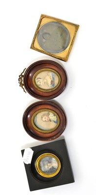 Lot 73 - A pair of oval miniatures; young lady and gentleman, an oval miniature of a lady in lace...