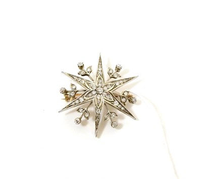 Lot 79 - A diamond set star brooch