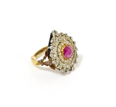 Lot 84 - An 18ct gold ruby and diamond cluster ring