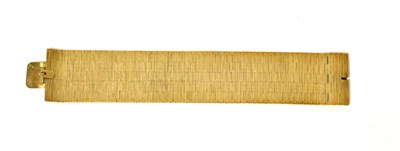 Lot 103 - A 9ct gold broad textured bracelet, length 17.8cm, width 3.1cm