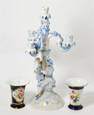 Lot 135 - Continental figural blue and white candelabrum and two modern flared Meissen vases (3)