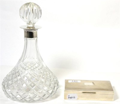 Lot 140 - A cut glass decanter and stopper with silver mount, 29cm high and silver hinged cigarette box (2)