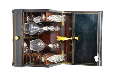 Lot 152 - A late 19th century brass bound and ebonised decanter table cabinet together with glasses and three