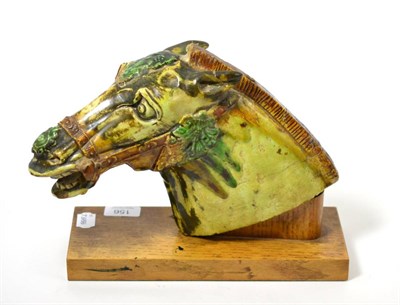 Lot 156 - Chinese pottery horse's head on wood stand