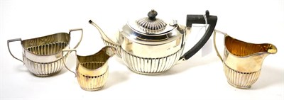 Lot 163 - A composite silver four piece tea set