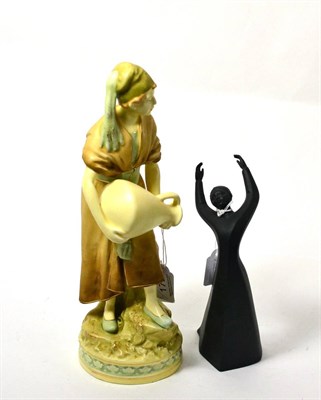 Lot 172 - A Royal Dux figure ";The Water Carrier"; together with a Royal Doulton figure ";The Awakening"; (2)