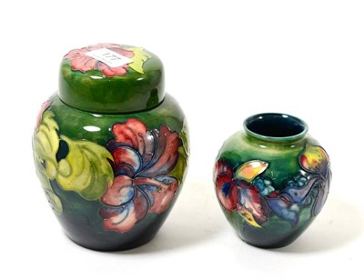 Lot 177 - A Moorcroft Hibiscus pattern jar and cover and an Orchid pattern vase (2)