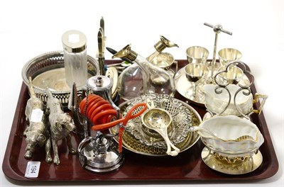 Lot 194 - A small group of silver including a tea strainer and condiment bottle, and plated wares...