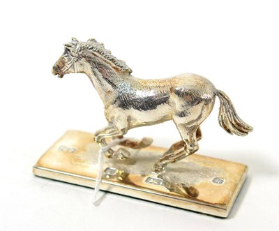 Lot 199 - A modern silver horse figure on rectangular base