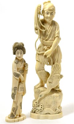 Lot 200 - A Chinese early 20th century ivory figure of a man with a heron and another of a lady (2)