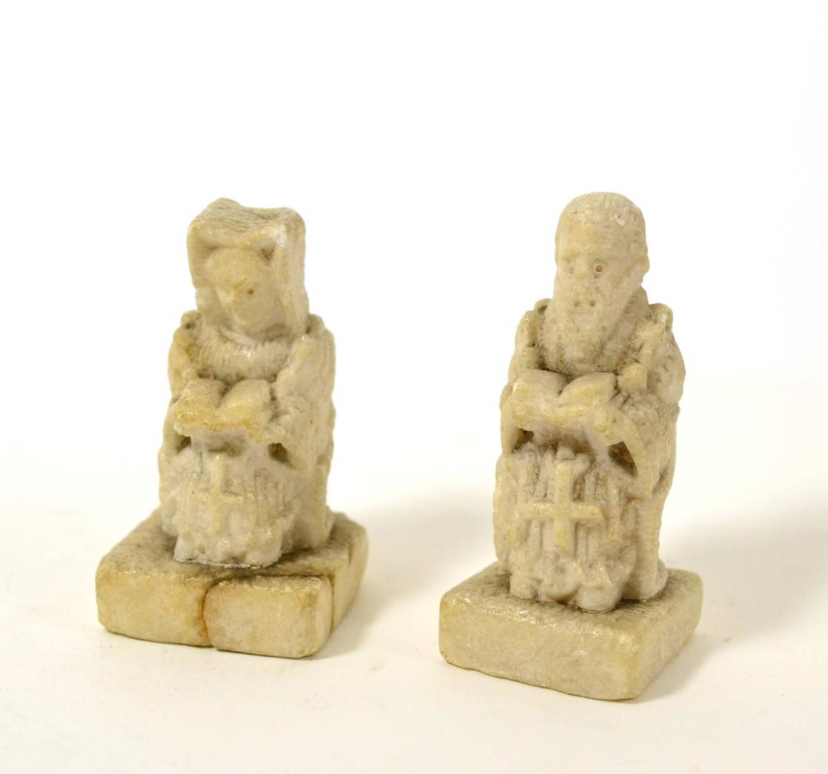 Lot 202 - Two medieval style carved alabaster figures, a male and female, raised upon square plinths