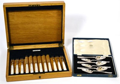 Lot 218 - A Sheffield silver teaspoon set, boxed, together with a Sheffield set of fruit knives and forks...