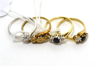 Lot 234 - Two 9ct gold sapphire and diamond three stone rings, a 9ct gold illusion set diamond three...