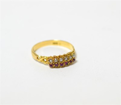 Lot 236 - A ruby and seed pearl ring, stamped 18ct