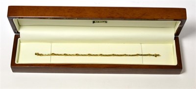 Lot 238 - A Continental 9ct gold and gem set bracelet, in case