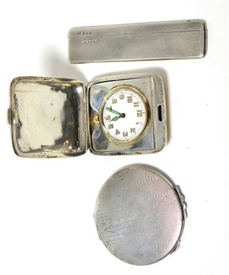 Lot 248 - A silver cased travel clock with inscription, a silver compact and a silver mounted comb and...