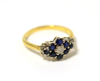 Lot 268 - A sapphire and diamond cluster ring, stamped 18ct