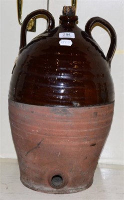 Lot 284 - An early 19th century brown glazed cider bottle with twin handles