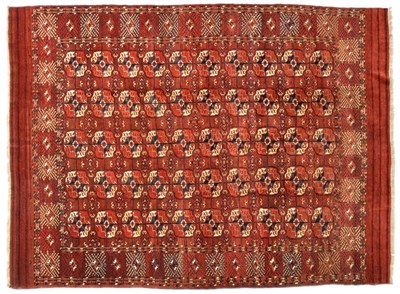 Lot 683 - Tekke Turkmen Main Carpet Emirate of Bukhara, circa 1890 The madder field with five columns of...