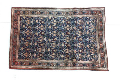 Lot 692 - Central Iranian Rug Veramin, circa 1960 The mid indigo field with a one way design of birds and...